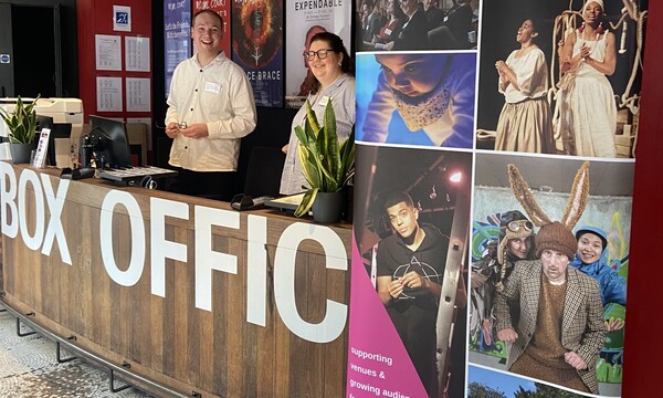 Will and Meghan behind the box office at the house Venue Network Day, Royal Court
