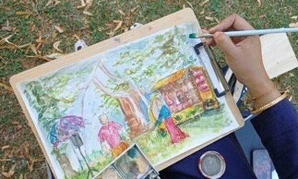 Artist hands, midst painting the Teabreak performance in watercolours