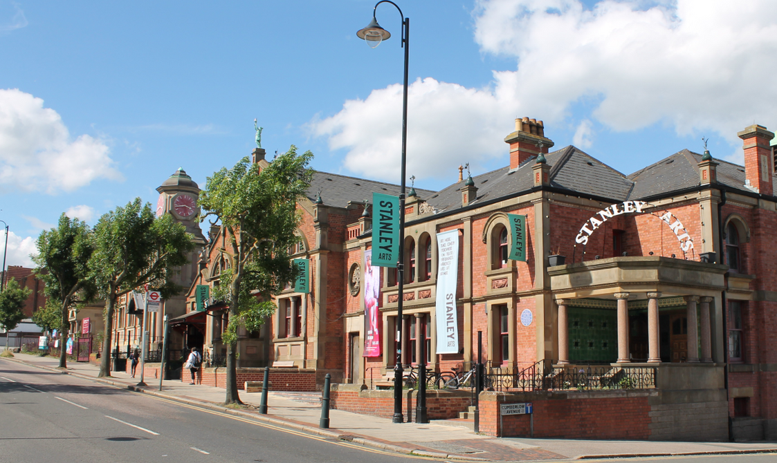 Outside of the Stanley Arts building with blue skies overhead
