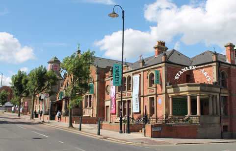 Outside of the Stanley Arts building with blue skies overhead