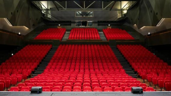 Red theatre seats inside the auditorium at G Live